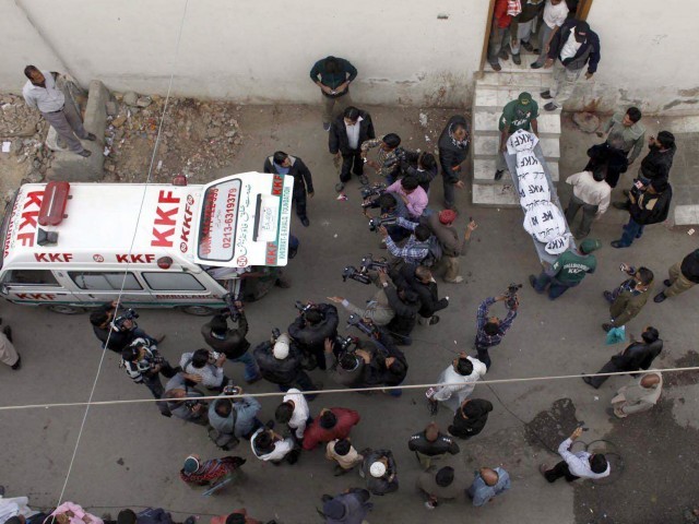 bodies being carried out from the shrine